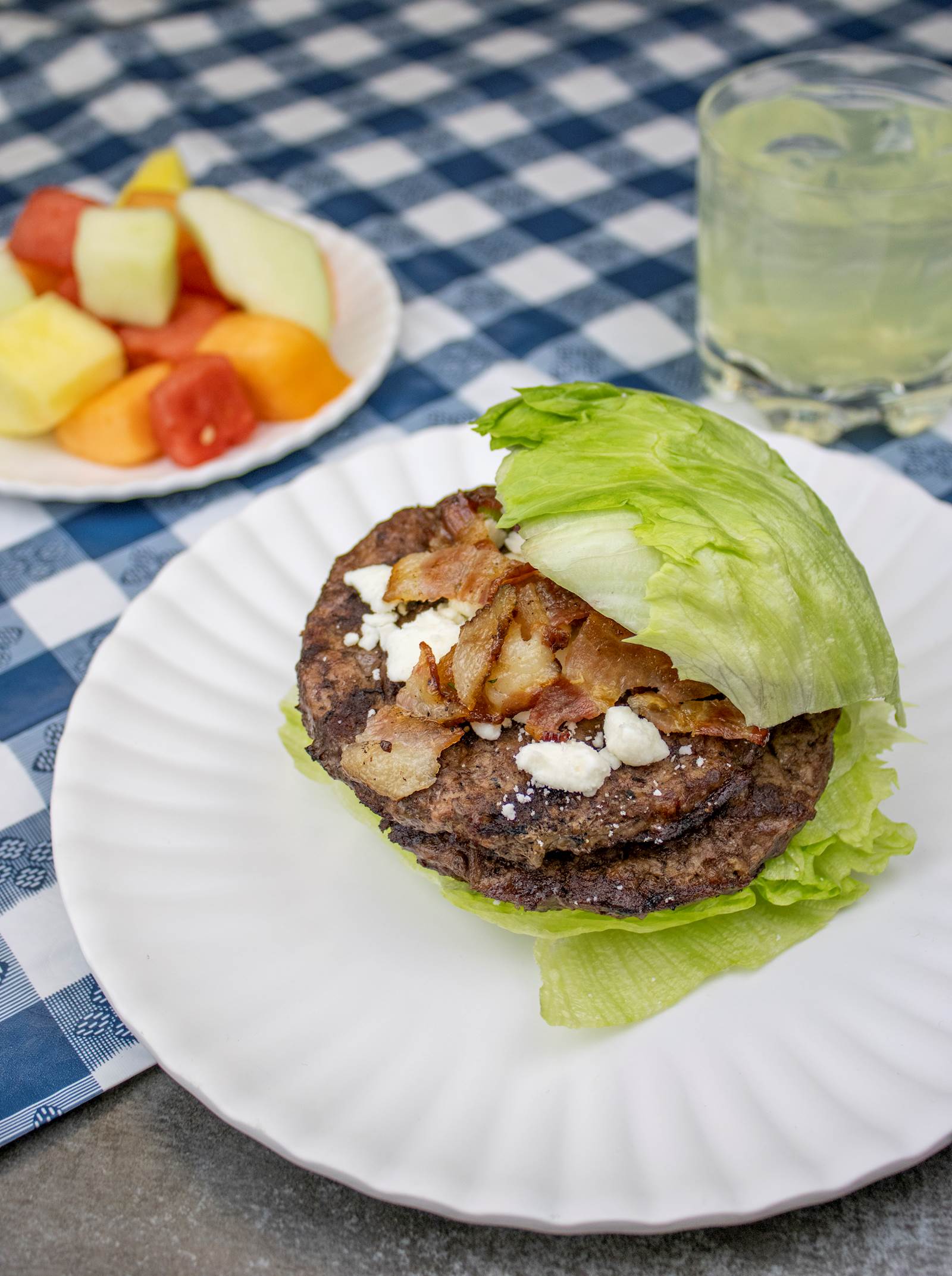 A double hamburger with bacon and cheese